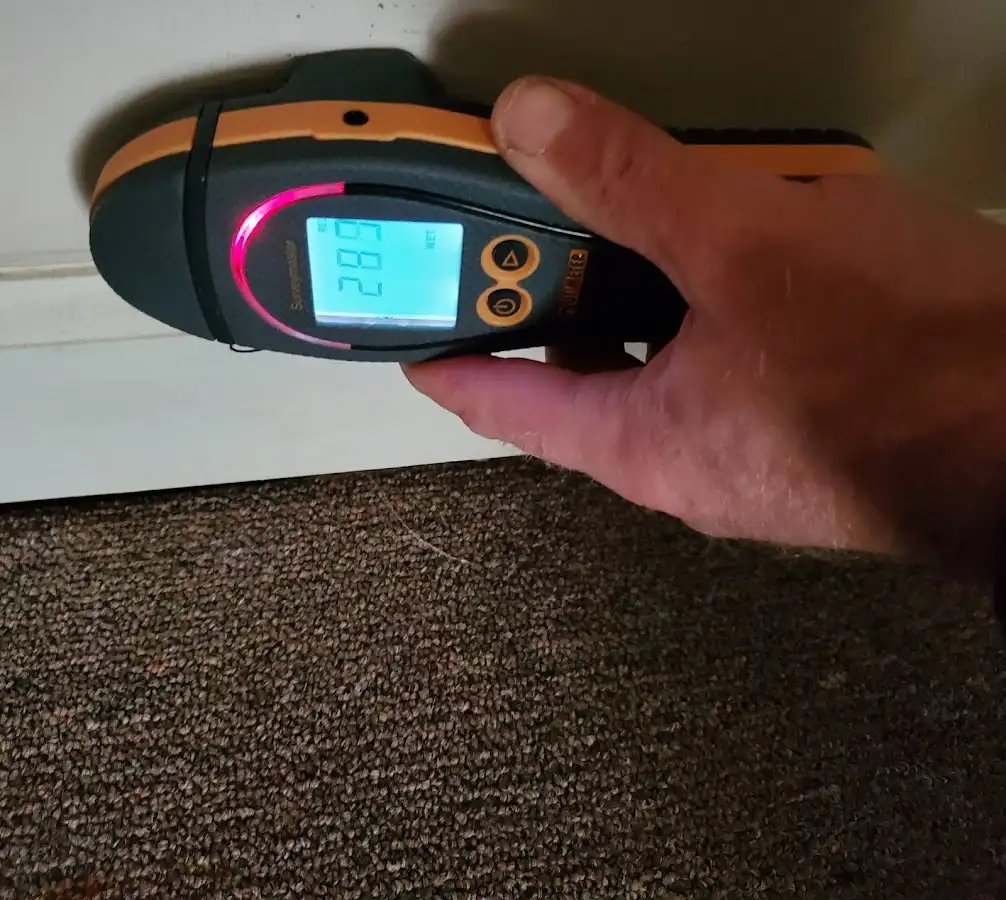 Moisture detection at baseboard during Storm Damage Restoration in Lodi